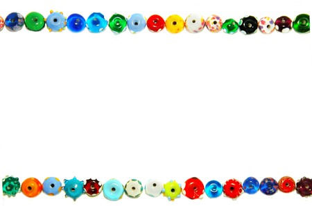 unique glass beads forming a border, on whiteの写真素材