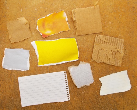 assorted pieces of ripped paper on grunge backgroundの写真素材