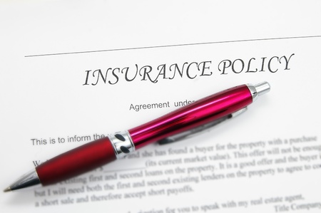 generic insurance policy with pen; could be life, auto, health etcの写真素材