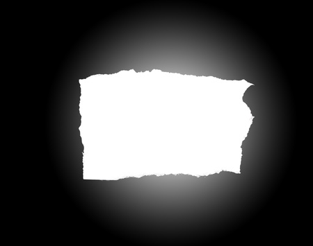 white hole torn in a piece of black paperの写真素材