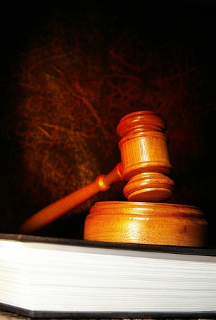 legal gavel on a law book in dramatic lightの写真素材
