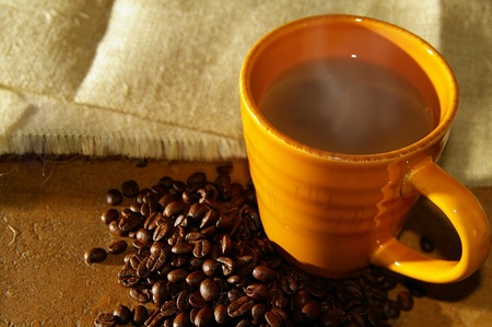 hot cup of coffee and coffee beansの写真素材