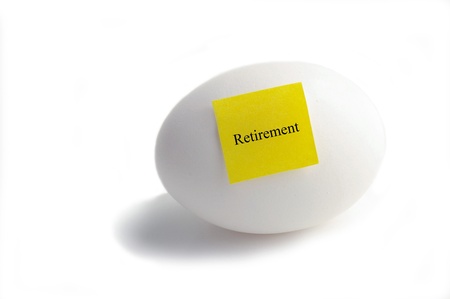 Egg with Retirement text on yellow note paper の写真素材