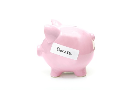 piggy bank with "donate" label, on whiteの写真素材