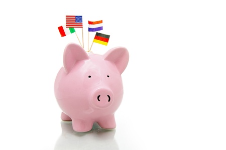 US and European flags and piggy bank on whiteの写真素材