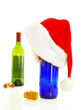wine bottles and santa hat - holiday party conceptの写真素材