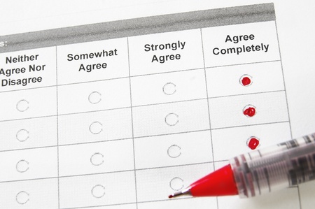 closeup of a survey form with agree remarks checkedの写真素材