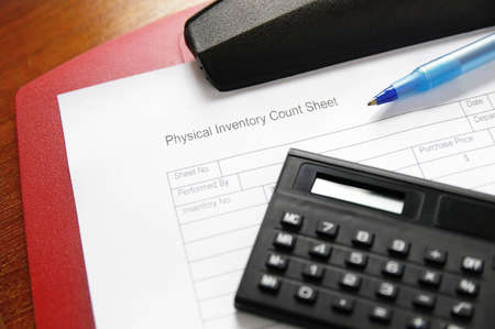 Business inventory sheet on a clipboard with penの写真素材
