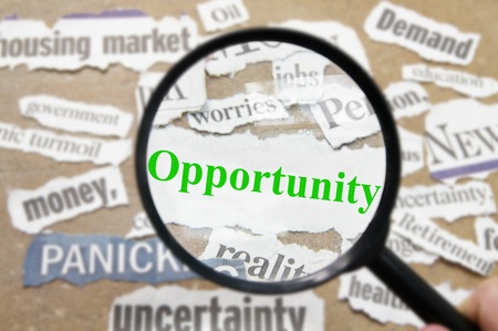 News headlines and magnifying glass with Opportunity textの写真素材