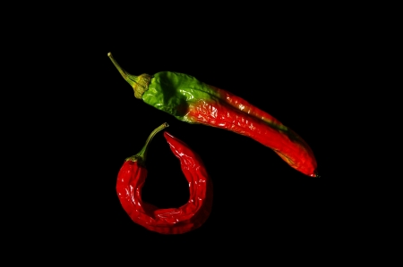 red hot peppers isolated on black backgroundの写真素材