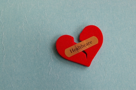 broken heart with a bandage and Healthcare textの写真素材