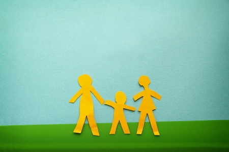 paper cutout family in an outdoor sceneの写真素材