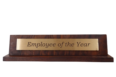 Wooden name plate, isolated on white, with Employee of the Year text                              の写真素材