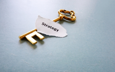 old key and Strategy text on paper scrap                                の写真素材