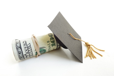Mortar board grad cap and money roll                               の写真素材