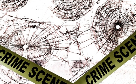 Crime scene police tape across broken glass windows                               の写真素材