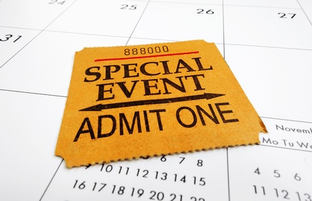 a closeup of a Special Event ticket stub on a calendar                               の写真素材