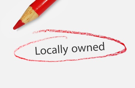Locally Owned text circled in red pencil - small business conceptの写真素材