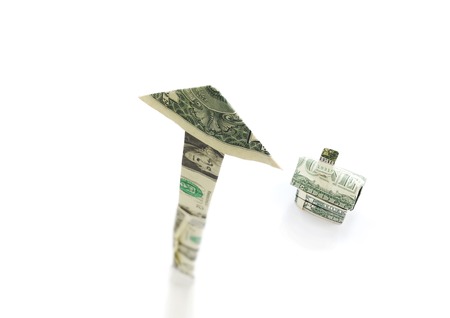 Dollar arrow pointing up with money house, on whiteの写真素材