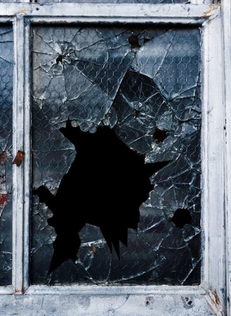 Shattered glass window and old frameの写真素材