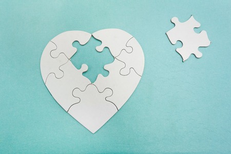 Heart shaped puzzle with missing pieceの写真素材