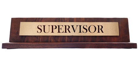 Wooden nameplate with Supervisor title, isolated on whiteの写真素材
