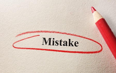 Red circle Mistake and pencil on textured paperの写真素材