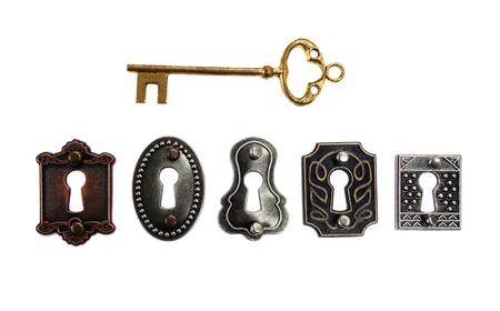 Assorted antique locks with gold key, isolated on whiteの写真素材