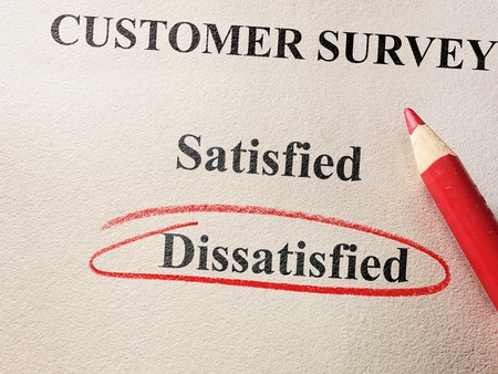 Dissatisfied circled in red circle on customer surveyの写真素材