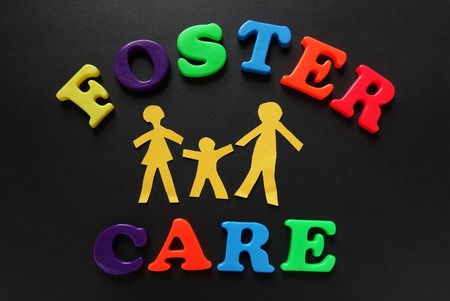 Paper cutout people with Foster Care lettersの写真素材
