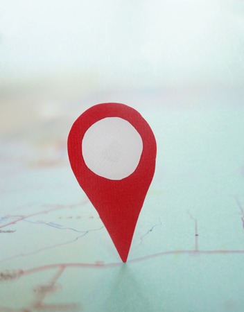 Red locator symbol on a mapの写真素材