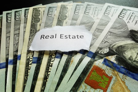 Real Estate paper note on hundred dollar billsの写真素材