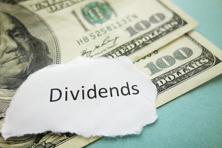 Closeup of Dividends message on cash - stock market conceptの写真素材
