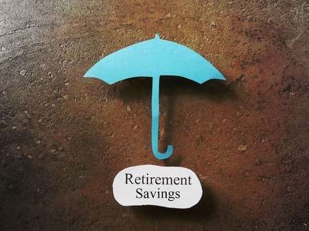 Paper umbrella over a Retirement Savings messageの写真素材