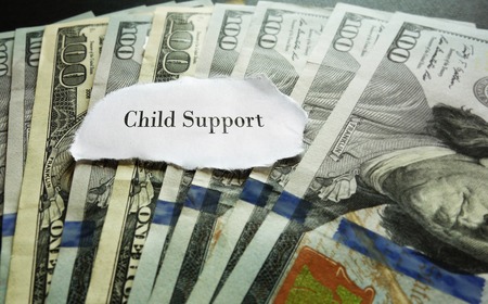 Closeup of hundred dollar bills with Child Support noteの写真素材