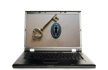 Laptop with a lock and key - online password conceptの写真素材