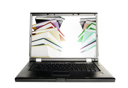 Laptop with a stack of books on screen -- e-learning or online research conceptの写真素材
