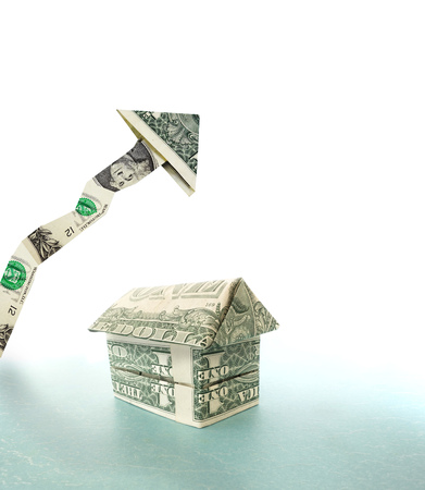 Money house with upward pointing dollar arrow -- housing prices conceptの写真素材