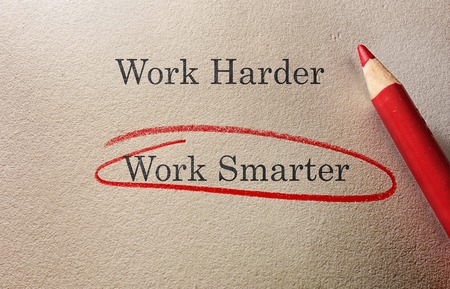 Work Smarter circled in red pencil with Work Harder textの写真素材