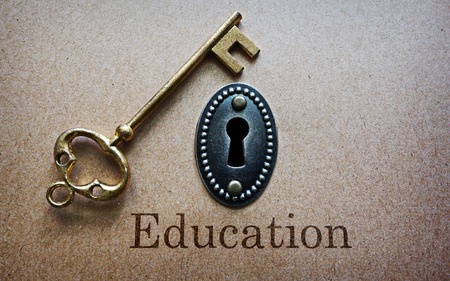 antique gold key and key hole with Education messageの写真素材