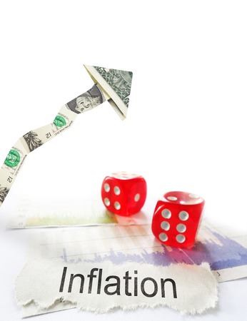 Inflation newspaper headline with dice and up dollar arrowの写真素材