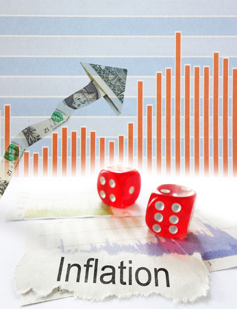Inflation newspaper headline with dice and up dollar arrow with graphの写真素材
