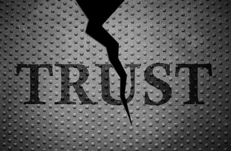 metal with rivet pattern and broken Trust textの写真素材