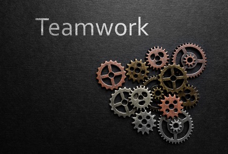 Assorted metal gears with Teamwork text on dark backgroundの写真素材