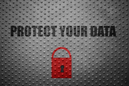 Red lock with Protect Your Data text on metal backgroundの写真素材
