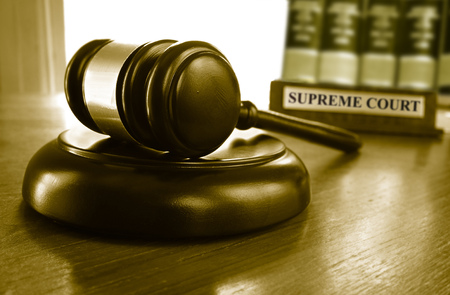 Judge's Supreme Court gavel with law booksの写真素材