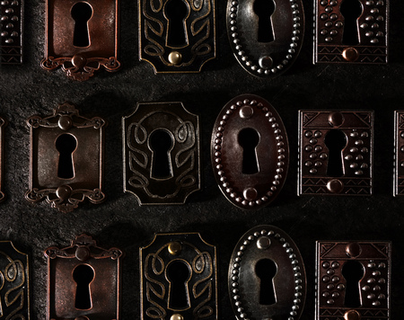 Assorted vintage locks in a row, on dark background                               の写真素材