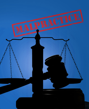 Court gavel and scales with Malpractice stampの写真素材