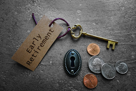 Early Retirement tag with gold key, keyhole and coins                              の写真素材