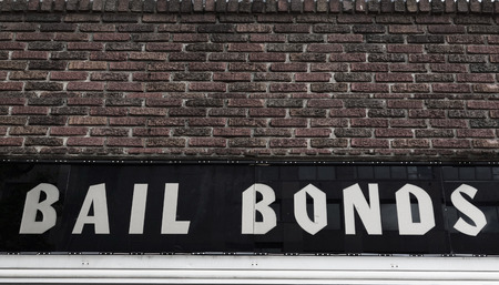 Bail Bonds sign on brick building exteriorの写真素材